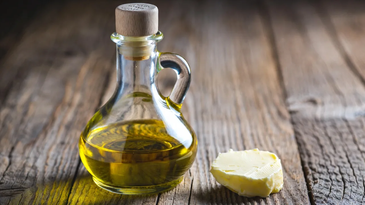 Butter and olive oil side by side, comparing cooking fats for healthy recipes